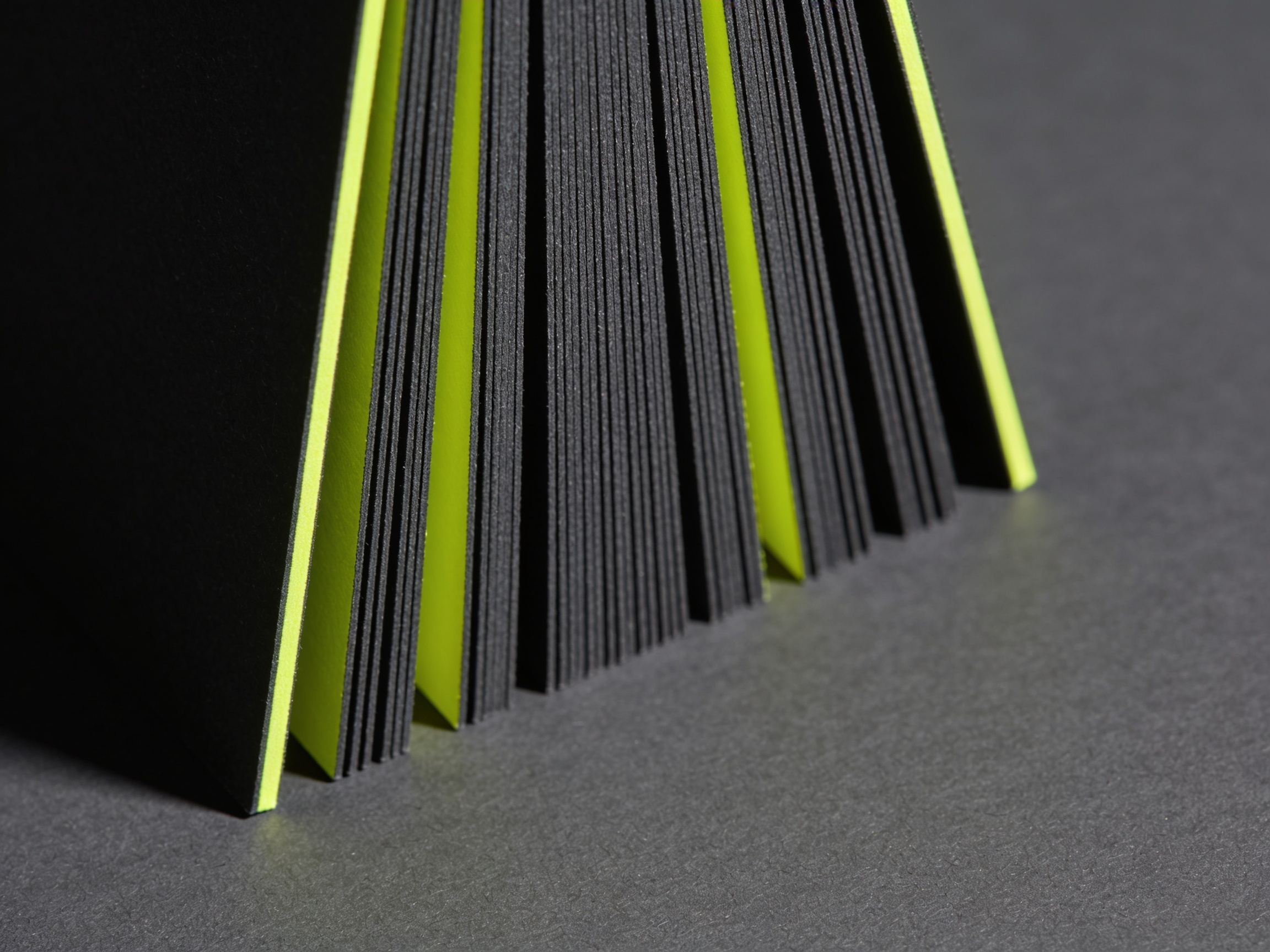 32pt cards standing on edge, a painted colour core running as a visible stripe through the middle of each one.